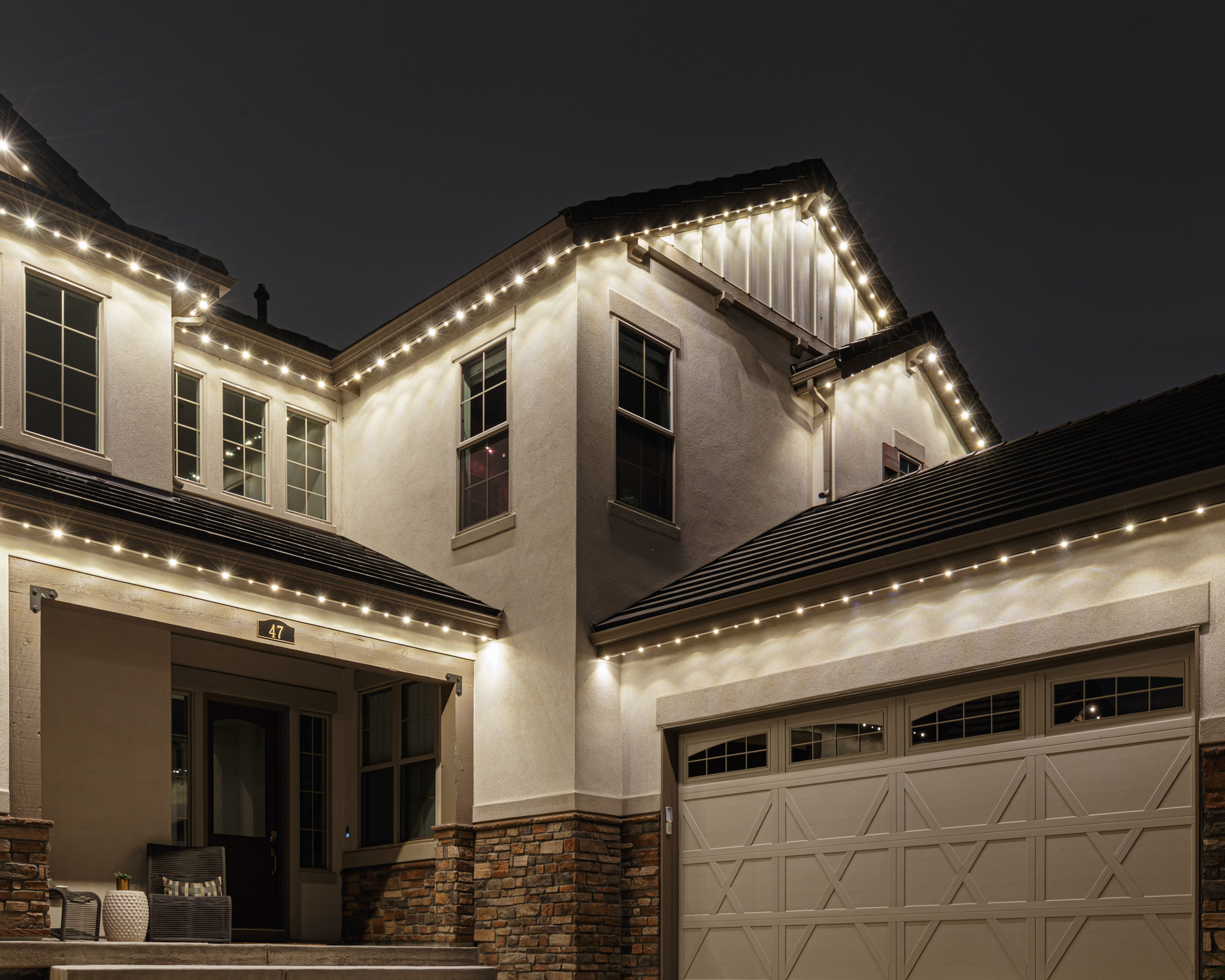 Warm white permanent track lighting on home